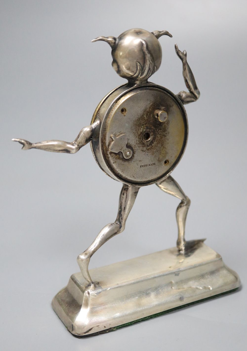 An early 20th century novelty silver mounted timepiece, modelled as the Lincoln Imp(a.f.), height 12.4cm, weighted.